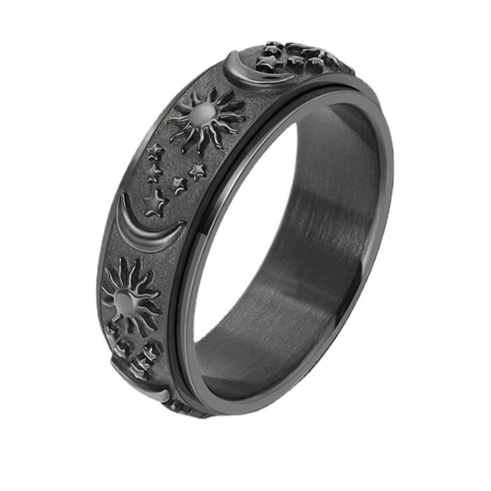 Black metal ring with sun and moon designs embossed on a white background