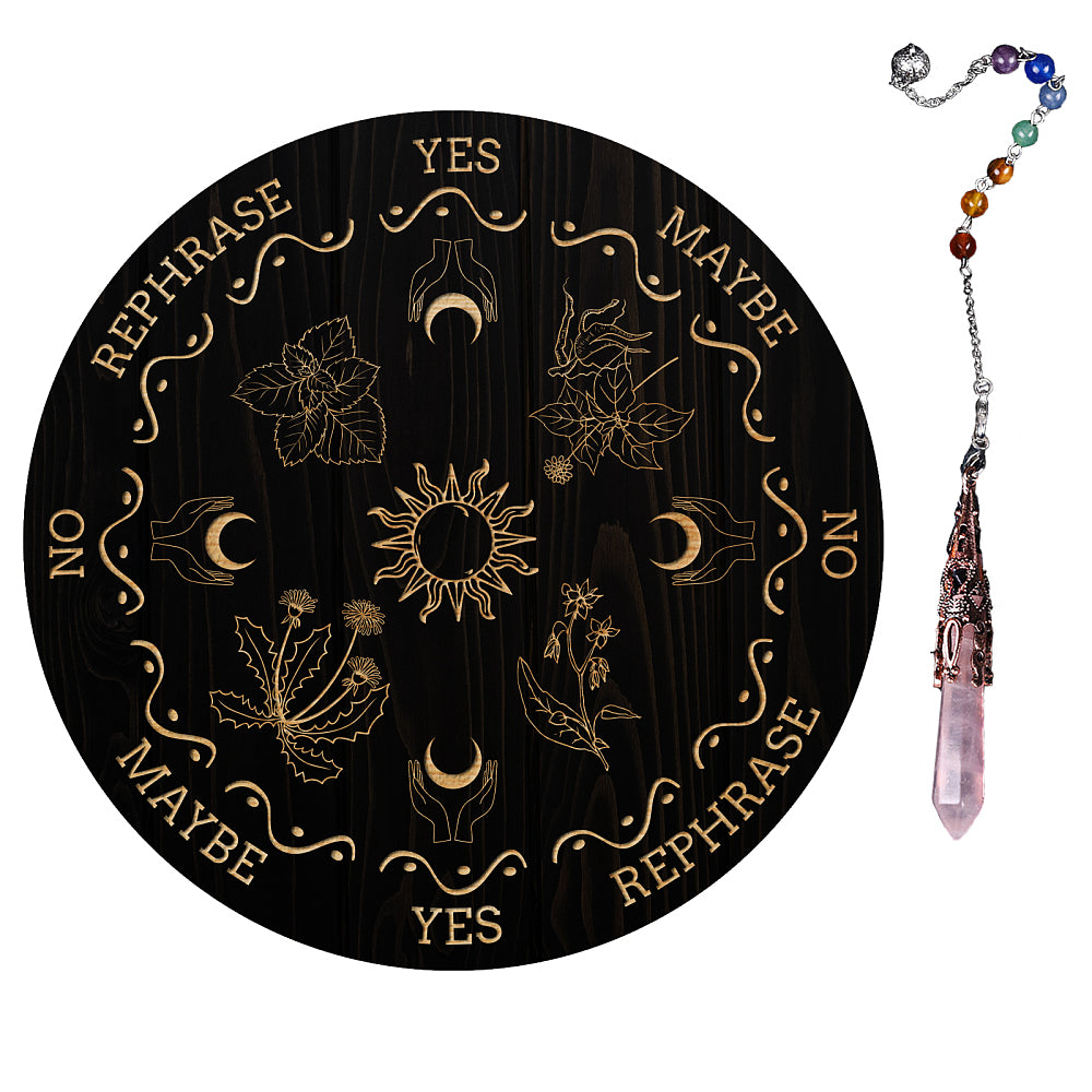 Black Pendulum Board with engraved images of the sun, crescent moons cupped in hands and divination phrases such a yes, no & rephrased laid out with the divination pendant laid on its right on a white background